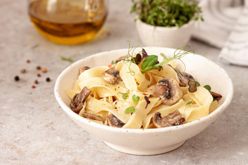 Homemade Italian fettuccine pasta with mushrooms and cream sauce.Traditional Italian cuisine