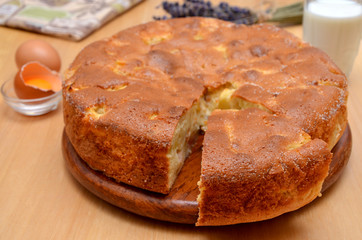  Charlotte pie on a wooden board close-up