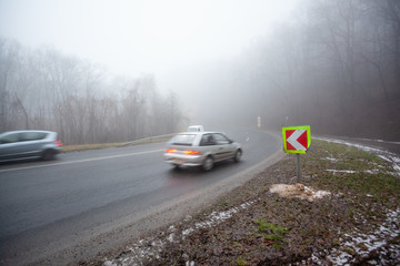 Moving car on highway with fog