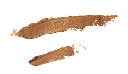 Cosmetic concealer smear strokes isolated on white background, tone cream smudged Corrector texture. Make Up.