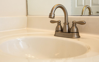 Fototapeta na wymiar Bathroom sink with chrome fixtures
