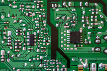 Close-up of electronic components. SMD resistors, capacitors, inductors and integrated circuits.