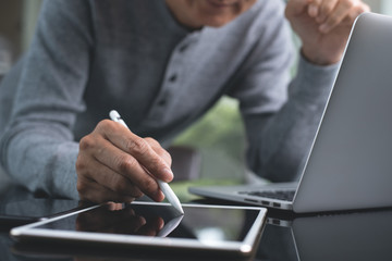 Working from home on laptop and tablet computer