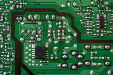 Close-up of electronic components. SMD resistors, capacitors, inductors and integrated circuits.