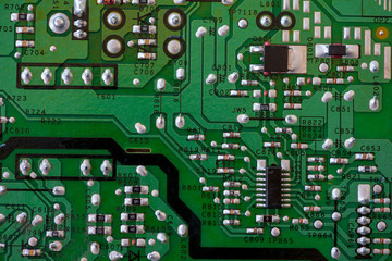 Close-up of electronic components. SMD resistors, capacitors, inductors and integrated circuits.