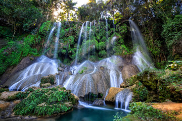 El Nicho Waterfalls in Cuba. El Nicho is located inside the Gran Parque Natural Topes de Collantes a forested park that extends across the Sierra Escambray mountain range in central Cuba.