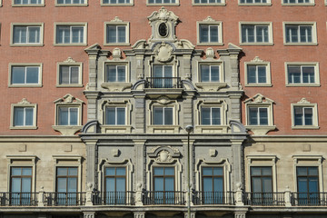 Fototapeta na wymiar balconies and windows of the facade of the Plaza building in Madrid. Spain