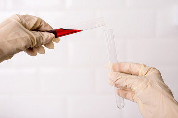 Laboratory technician working with test tube.