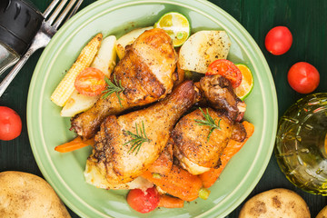 Grilled chicken leg with boiled potatoes and vegetable