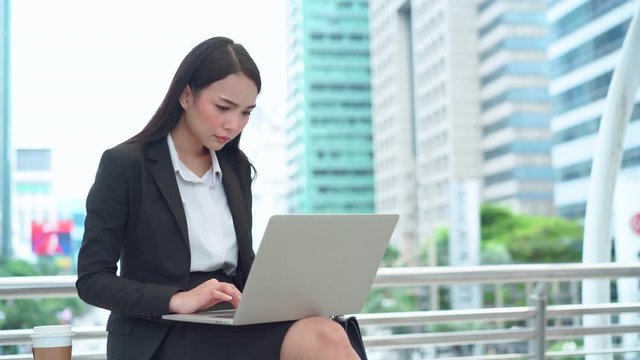 Asian business female fail with bad news email on computer laptop