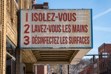 French movie cinema billboard with three rules to avoid the coronavirus epidemic. Translation, wash hands, maintain social distance and clean surfaces
