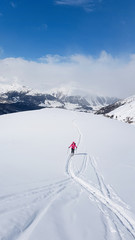 Fototapeta na wymiar Skitouring in the mountains snow winter