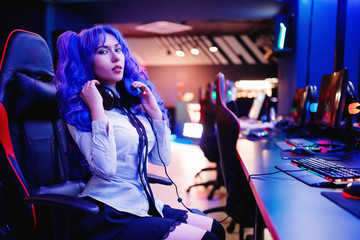 Young woman professional gamer playing winning tournaments online games computer © Parilov