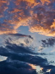 beautiful cloudy sky lit by the setting sun. Evening summer sky.