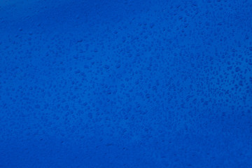 Rain Drops on Saturated Blue Metallic Background