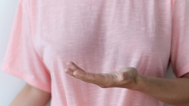 Woman with a small bottle of hand sanitizer