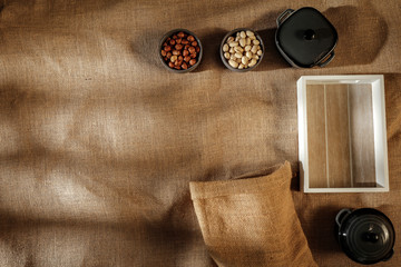 Flat light brown beige linen background seen from above with copy space for advertising products.