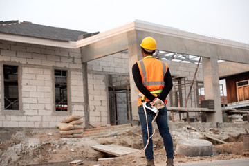 Roofing work, wearing safety clothing Engineer working in structure at Construction Site,Construction concepts.