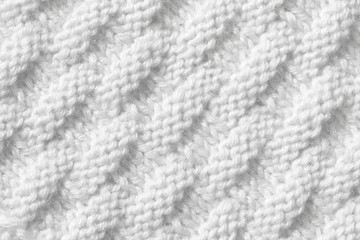 Texture pattern knitting with acrylic thread. Manual work with knitting needles, white background of wool.