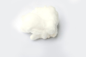Cloud made out of cotton wool on white background
