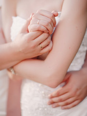 bride and groom holding hands