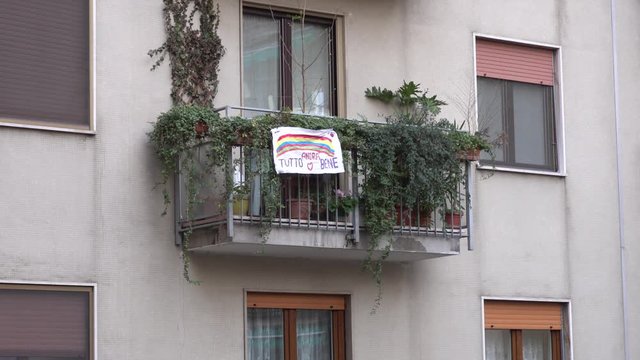 Europe, Italy, Milan March 2020, Coronavirus emergency - On the windows of the city hang sheets designed by children with rainbow and the words "everything will be fine" ( Tutto Andra' bene 