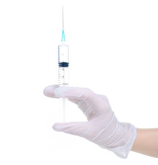 Syringe in medical glove hand on white background isolation