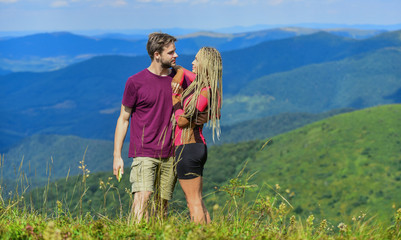 Love and trust. Romantic relations. Journey to mountains concept. Honeymoon in highlands. Two hearts full of love. Beautiful couple embracing landscape background. Couple in love summer vacation