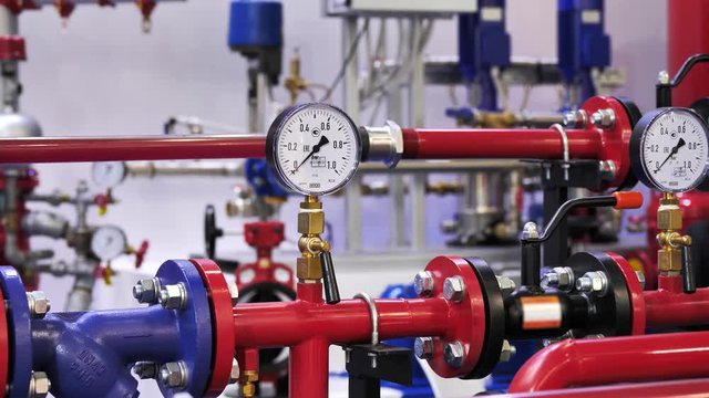Industrial plumbing pipes with water pressure meter
