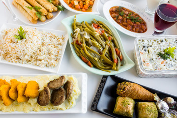 Setting table (Bayram sofrasi) with traditional Turkish foods for Sugar Feast after Ramadan Eve or Feast of Sacrifices. 	