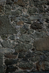 Texture of stone wall made of grey stones