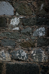 Texture of stone wall made of grey stones