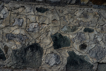 Fototapeta premium Texture of stone wall made of grey stones
