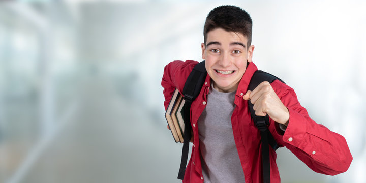 teenage student in a hurry or running in college