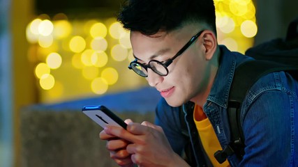 man use smart phone outdoor - Powered by Adobe