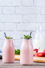 Pink smoothie with banana and strawberry for healthy, vegan diet