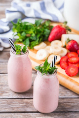 Pink smoothie with banana and strawberry for healthy, vegan diet