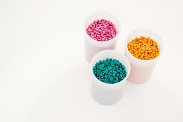 Plastic granules close up for holding,Colorful plastic granules with white background. and dollar money,Plastic Business,Plastic industry.