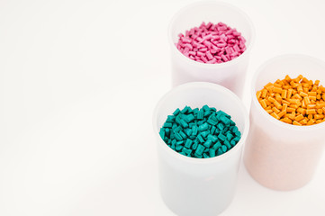 Plastic granules close up for holding,Colorful plastic granules with white background. and dollar money,Plastic Business,Plastic industry.
