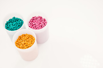 Plastic granules close up for holding,Colorful plastic granules with white background. and dollar money,Plastic Business,Plastic industry.