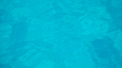swimming pool with flow water wave and bottom surface texture and see top view using for background or banner summer concept.