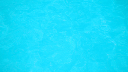 swimming pool with flow water wave and bottom surface texture and see top view using for background or banner summer concept.