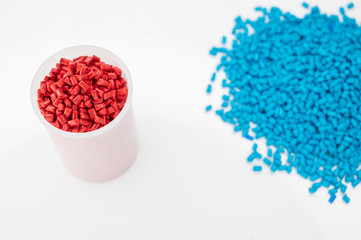 Plastic granules close up for holding,Colorful plastic granules with white background. and dollar money,Plastic Business,Plastic industry.