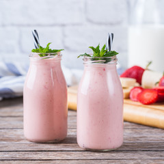 Pink smoothie with banana and strawberry for healthy, vegan diet