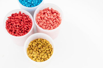 Plastic granules close up for holding,Colorful plastic granules with white background. and dollar money,Plastic Business,Plastic industry.
