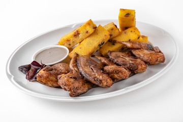 Grilled quails in a sauce with vegetables and herbs. Gentle, diet poultry meat. Banquet festive dishes. Gourmet restaurant menu. White background.