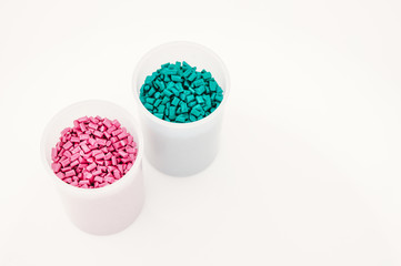 Plastic granules close up for holding,Colorful plastic granules with white background. and dollar money,Plastic Business,Plastic industry.