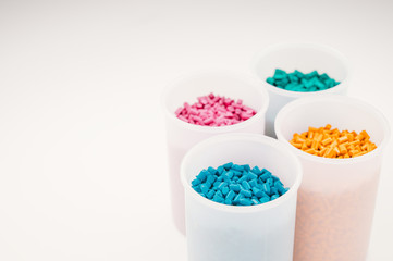 Plastic granules close up for holding,Colorful plastic granules with white background. and dollar money,Plastic Business,Plastic industry.