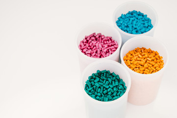 Plastic granules close up for holding,Colorful plastic granules with white background. and dollar money,Plastic Business,Plastic industry.