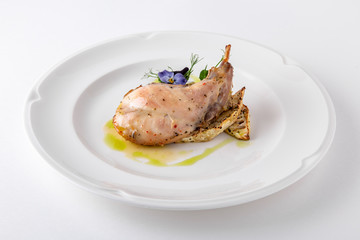 Baked tender juicy rabbit leg with celery. Banquet festive dishes. Gourmet restaurant menu. White background.